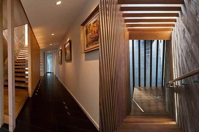 Paunui House vertical timber staircase by Faulkner Construction