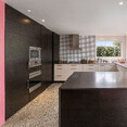 Old Mill House Kitchen are with Pink wall, and a combination of dark and light cabinetry