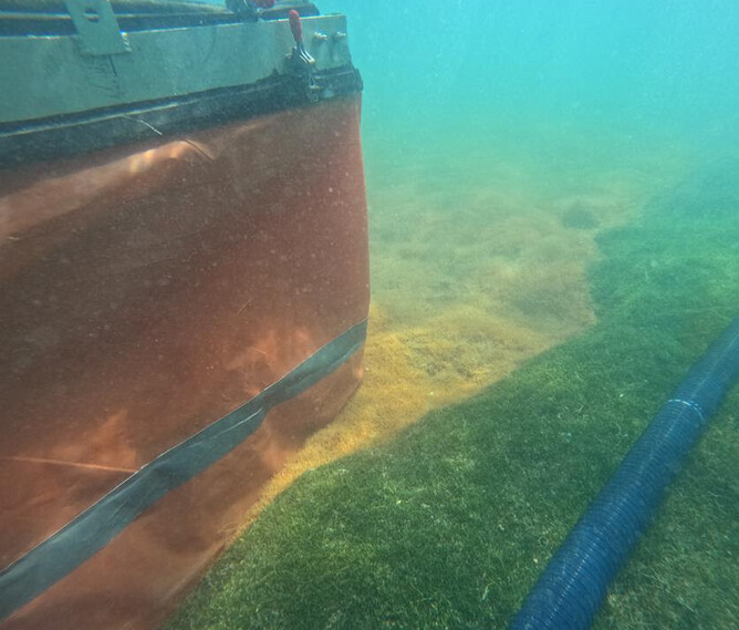 Commercial Dive Specialists’ early prototype of an enclosure to contain chlorine treatment to a target area. Green is the caulerpa and brown area is treated.