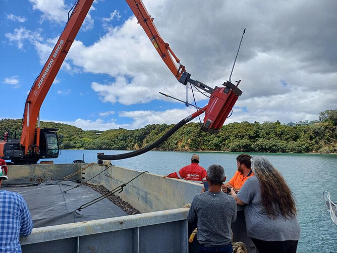 The suction-dredge equipment showing the suction head (in the air) and the capture bin. Photo: Northland Regional Council