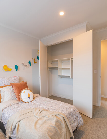 Kids bedroom wardrobe with a simple wall hung wardrobe system.