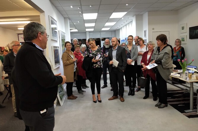 Waikato District Mayor Allan Sanson addresses the exhibition audience