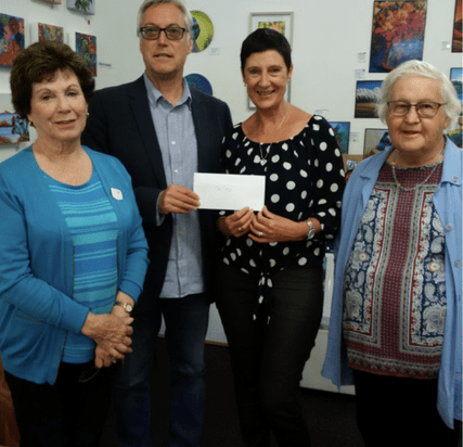 Receiving donation for $2,000.00 to support their services.