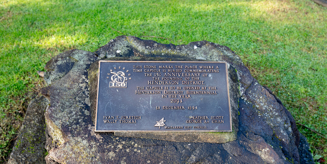 A rock with a plaque marking the spot where a time capsule is buried