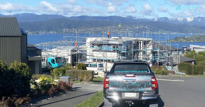 Scaffolding project near coast with King Kong Scaffold truck in foreground.