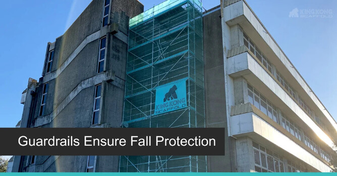 High-rise building scaffolding with visible guardrails for fall protection.
