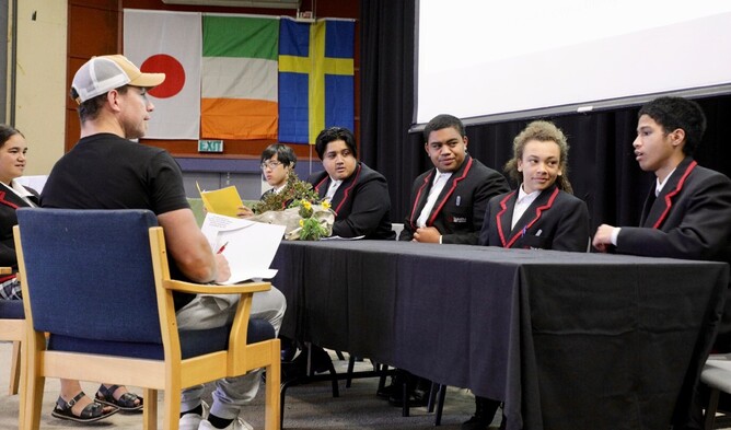 Tamatea High School Yr 11 students (l to r) Pearl Harmer, Rio Udarbe, Kahu Kopu-Neera, Te Omeka Kahui listen on as Ocean Karaitiana pitches their idea to Levi Armstong.