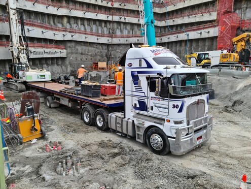 Photo of Mackenzie Transport crane truck lifting a freight container