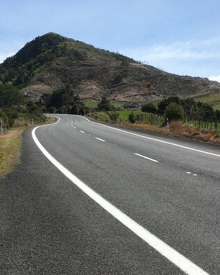SH25 curving up Myndermans Hill in Kuaotunu on the Coromandel Peninsula