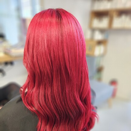 A beautiful bright red/pink long hair colour by Hair by Shiyee.