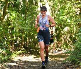 Sam Houwers, VP of Rotorua Triathlon + Multisport running a forest track around Rotorua