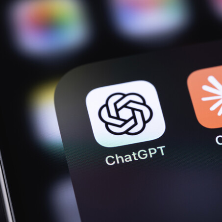 Close up of iphone screen with ChatGPT & Claude app icons
