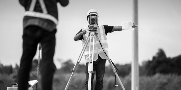 Man using surveying equipment