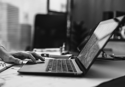 Hands using a laptop computer