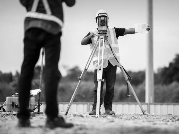 surveyors using surveying equipment
