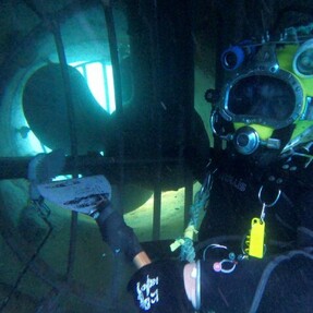Diver working on vessel offshore