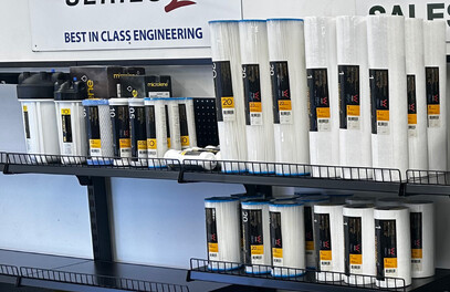 A shelf with a selection of water filters on it