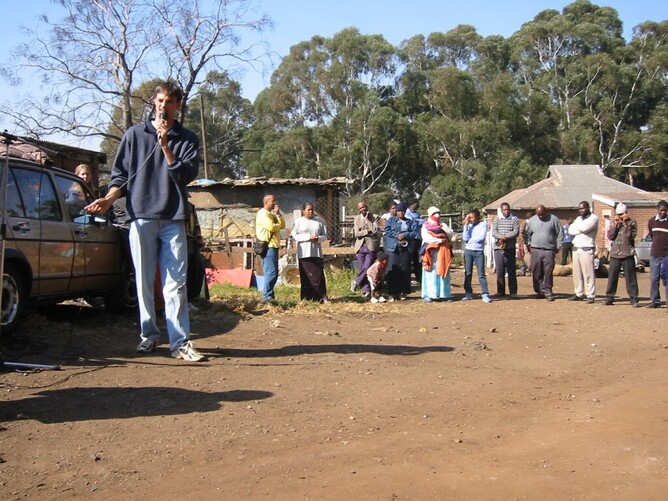 Herman presenting a gospel message during his training with OM in 2003