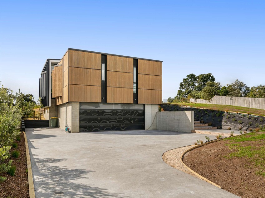 Image of a residential home renovation. Newly remodelled exterior, decking and landscaping by Auckland builders, Eden Construction. New Zealand.