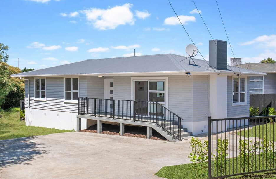 Image of a residential home renovation. Newly cladded, decked and landscaped by Auckland builders, Eden Construction. New Zealand.