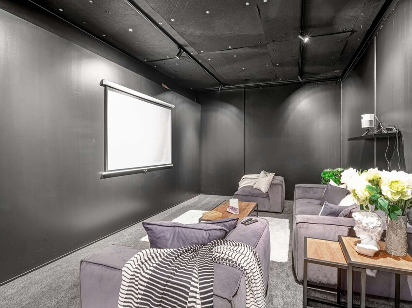 Image of a residential home renovation. Newly remodelled cinema room by Auckland builders, Eden Construction. New Zealand.