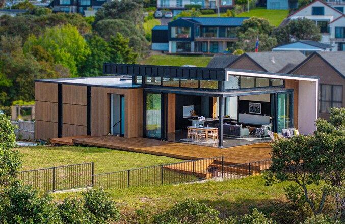 Image of a residential home renovation. Newly remodelled exterior, decking and landscaping by Auckland builders, Eden Construction. New Zealand.