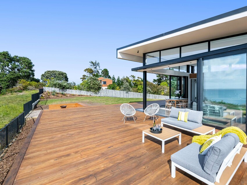 Image of a residential home renovation. Newly remodelled exterior, decking and landscaping by Auckland builders, Eden Construction. New Zealand.