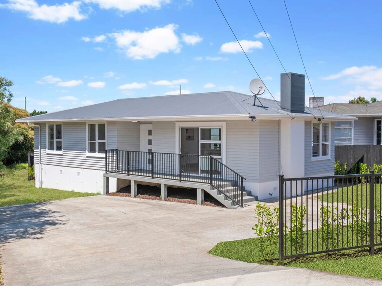 Image of a residential home renovation. Newly cladded, decked and landscaped by Auckland builders, Eden Construction. New Zealand.