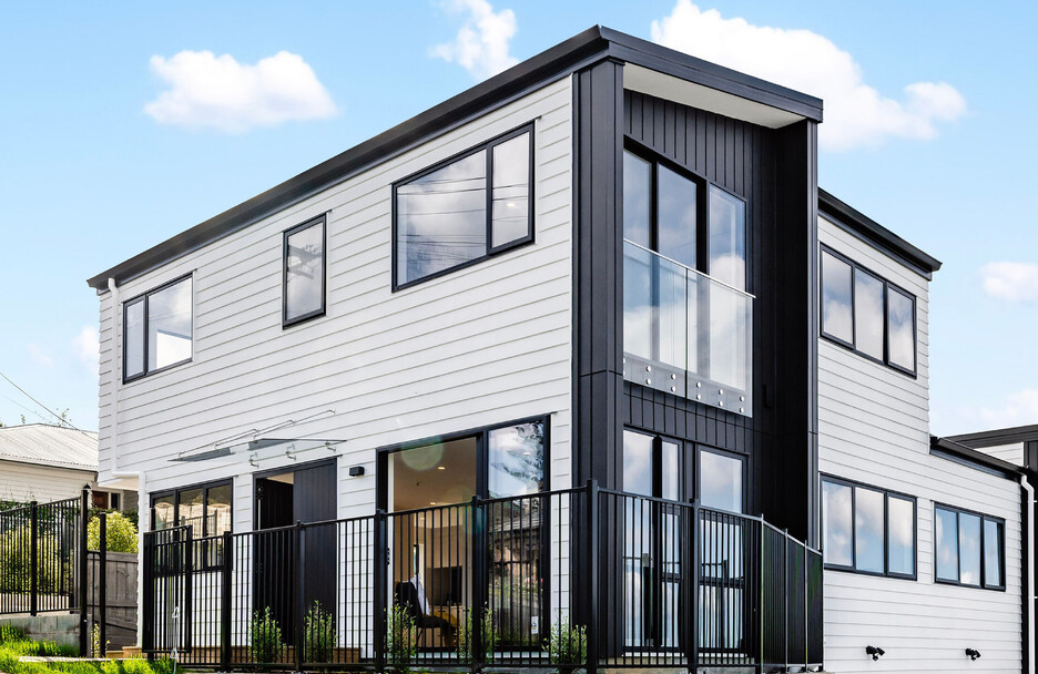 Image of a residential new build home. Newly constructed modern townhouses on Roland Hill, Glen Eden, Auckland. Built by Auckland builders, Eden Construction. New Zealand.