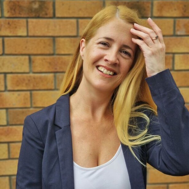 Amber Dixon pointing both hands upwards