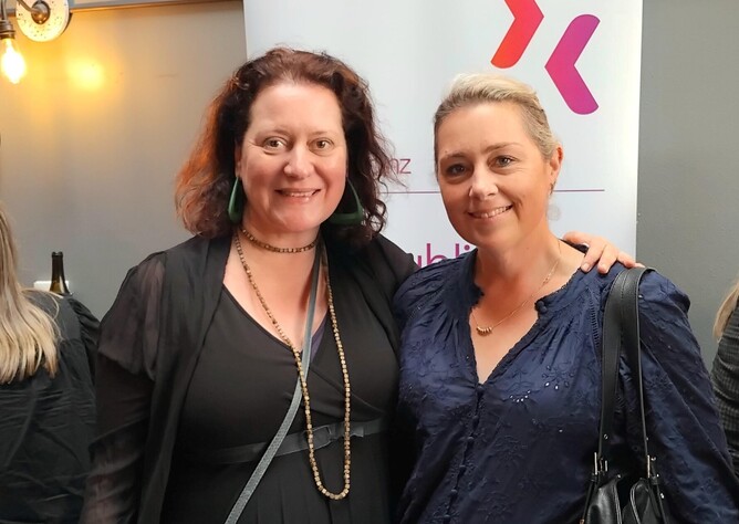 Two ladies standing together at a networking event at PRINZ event.