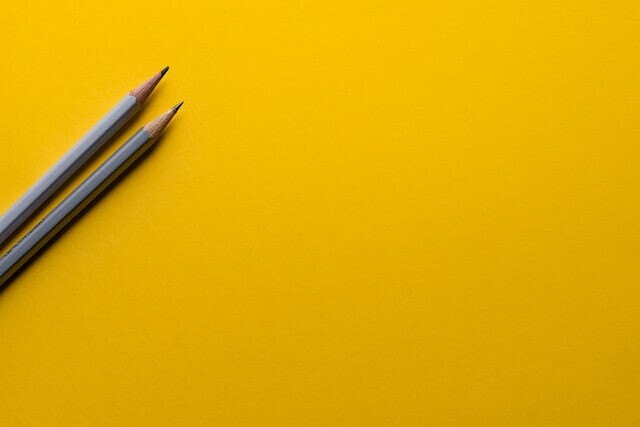 Simple image of pencils and yellow background
