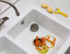 Why Professional Drainlayers Warn Against Food Waste Disposers with Treatment Systems