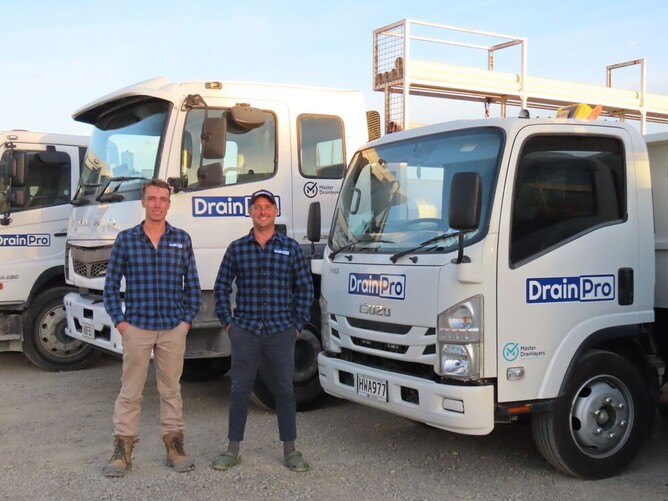 Drainpro staff with trucks