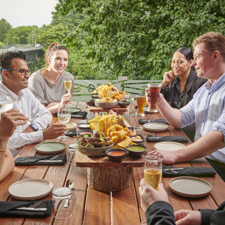 Craig Brown Photographer's image of a group of people enjoying lunch outside by the river
