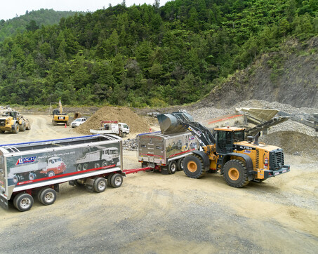 Craig Brown Photographer's image of diggers loading trucks at a work site