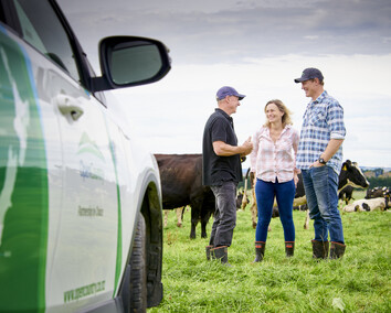 Craig Brown Photographer's image of open country staff talking to farmers in a paddock