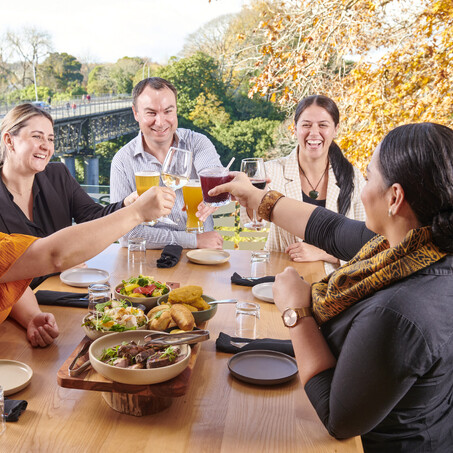 Craig Brown Photographer's image of a group of people having lunch by the Waikato River