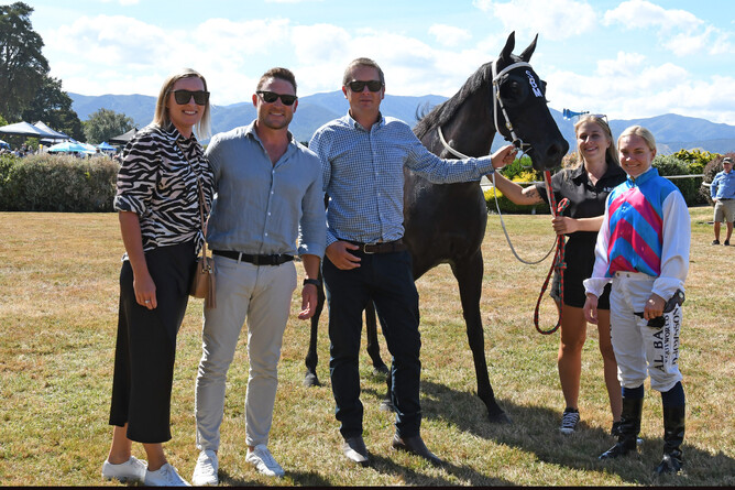Brendon McCullum and wife Ellissa celebrate the stakes victory of their mare Tabata with trainer Stephen Marsh and jockey Danielle Johnson. Photo: Peter Rubery (Race Images Palmerston North)