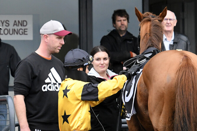 Brad Carsons and Natalie Jamieson welcome back a victorious Cannsea Clearly and jockey Joe Kamaruddin at Rotorua on Wednesday. Photo: Kenton Wright (Race Images)