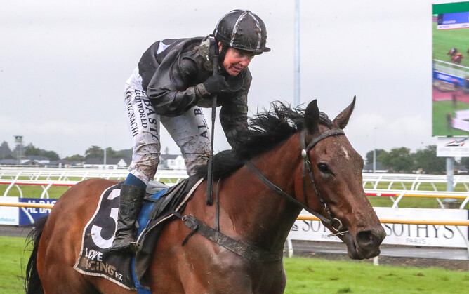 Jockey Tina Comignaghi celebrates a dominant victory by Bozo in the Gr.3 Martin Collins New Zealand Cup (3200m). - Photo: Race Images South