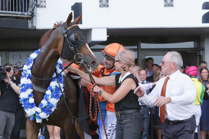 Co-trainer Bob Vance looks on as wife Jenny takes a hold of Royal Performer as he is unsaddled by rider Jonathan Riddell Photo Credit: Trish Dunell