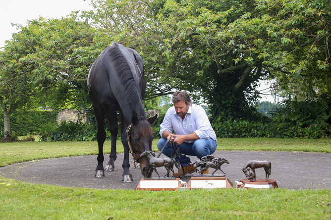 Waikato Stud’s Mark Chittick looks on as newly crowned Savabeel inspects his trophies from the 2020-21 season. Photo: Picket Fence