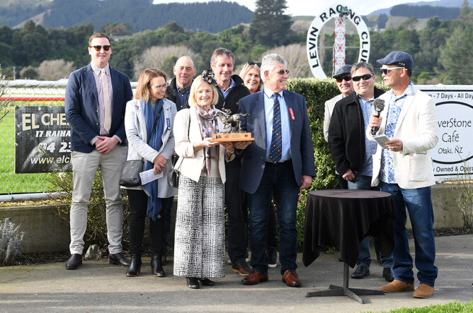 Co-owners and breeders Sharyn and Mike Craig (centre) join co-trainer Robert Wellwood (left) and their fellow owners to celebrate Itza Charmer’s Ryder Stakes win at Otaki. - Photo: Race Images