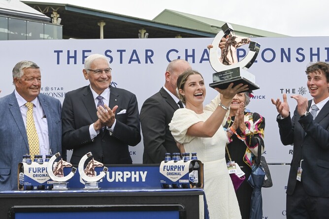 Charlotte Chittick accepts the trophy following I Wish I Win’s Gr.1 T.J. Smith Stakes (1200m) triumph - Photo: bradleyphotos.com.au