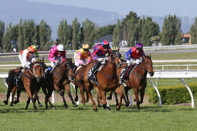 Toms (red and blue cap) on his way to winning the Listed Feilding Gold Cup - Trish Dunell