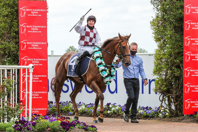 Lisa Allpress salutes as she returns to the Riccarton birdcage aboard Babylon Berlin Photo Credit: Race Images South