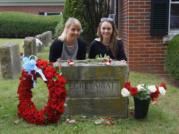 Holly Ross and her sister Laura visits Secretariat's grave at Claiborne Farm
