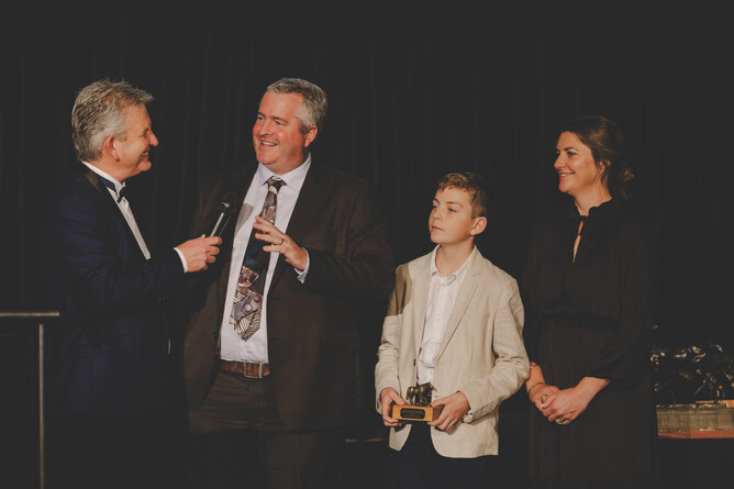 Steve Davis interviews Fraser Auret alongside his son Milton and wife Erin at the National Breeding Awards on Saturday - Photo: Christine Cornege