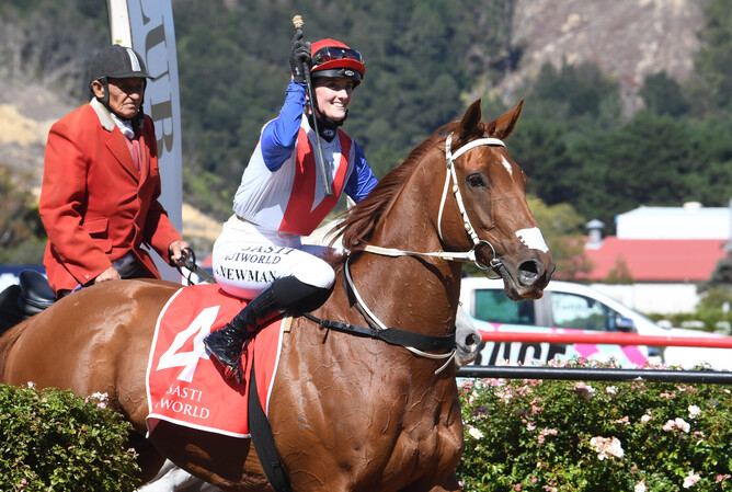 Tegan Newman salutes to Our Echo's victory in Saturday's Listed Lincoln Farms Lightning Handicap (1200m) at Trentham. - Photo: Peter Rubery (Race Images Palmerston North)